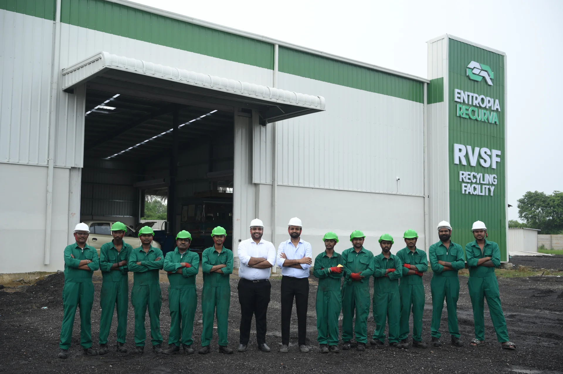 Entropia Recurva team in green uniforms outside the facility